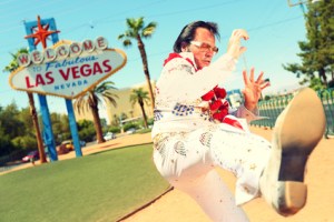 Elvis look-alike impersonator and Las Vegas sign