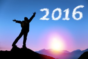 happy new year 2016.man on top of the mountain looking the cloud